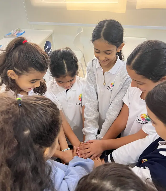 Teacher with child at Bright Minds International School